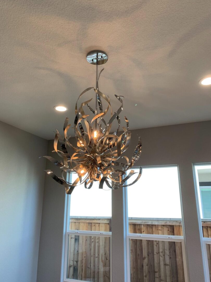 A chandelier in the middle of a room.