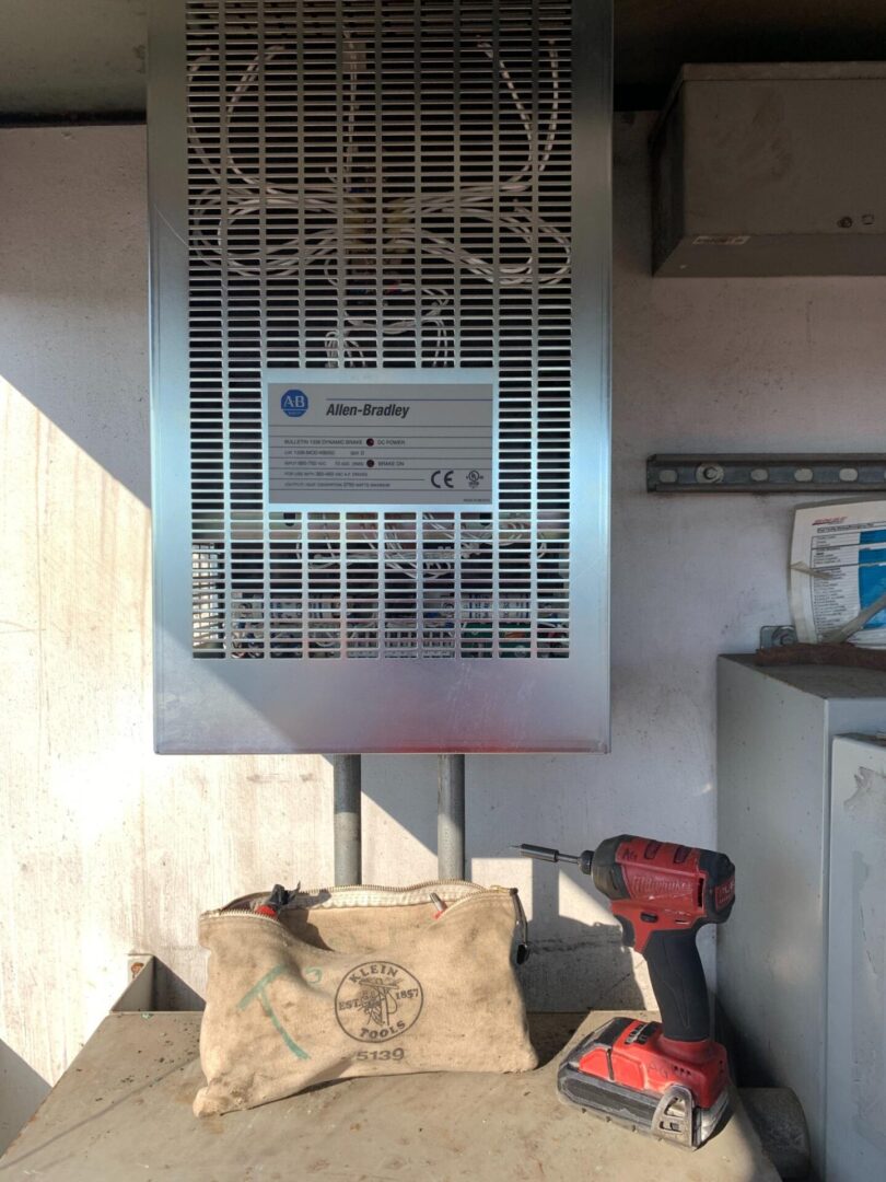 A wall mounted air conditioner unit in the corner of a room.