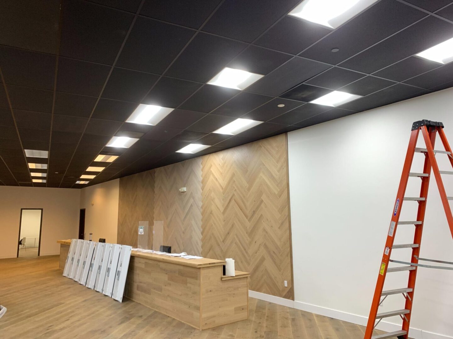 A room with a wooden wall and ceiling