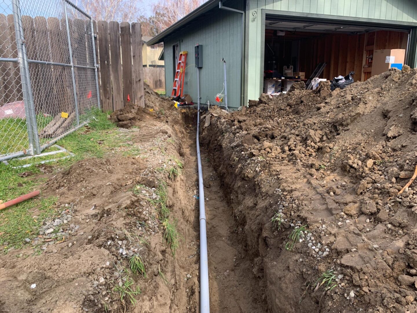 A house with a bunch of dirt on the ground