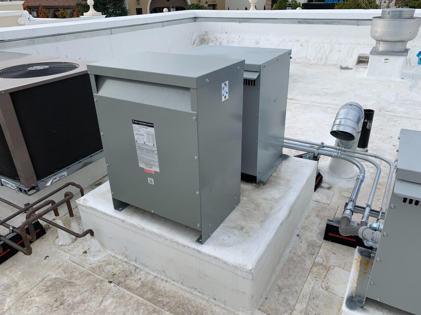 A large metal box sitting on top of a building.