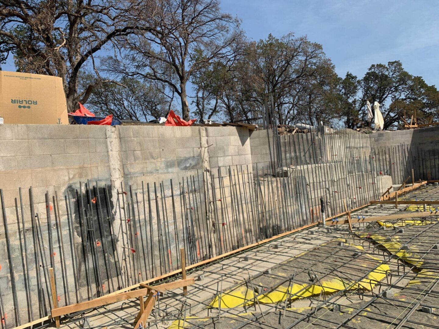 A fence that has been built around the perimeter of a building.