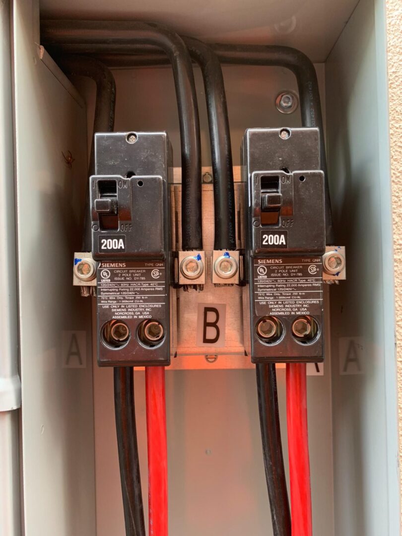 A close up of the electrical box with wires